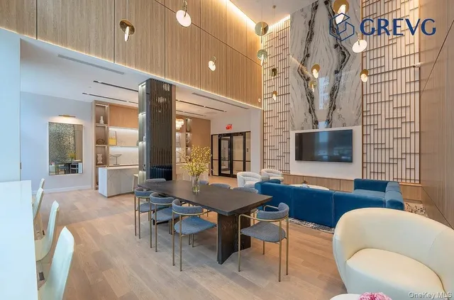 a view of a livingroom with furniture and a flat screen tv