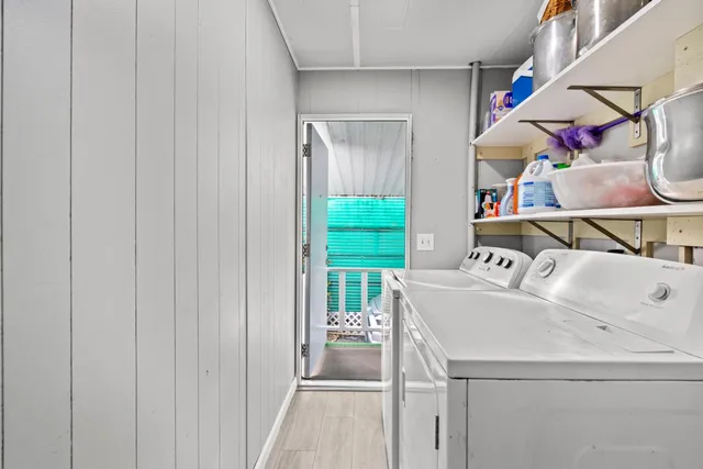 a view of two chairs in the balcony