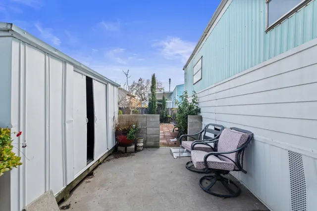 a view of a chairs and table in a patio
