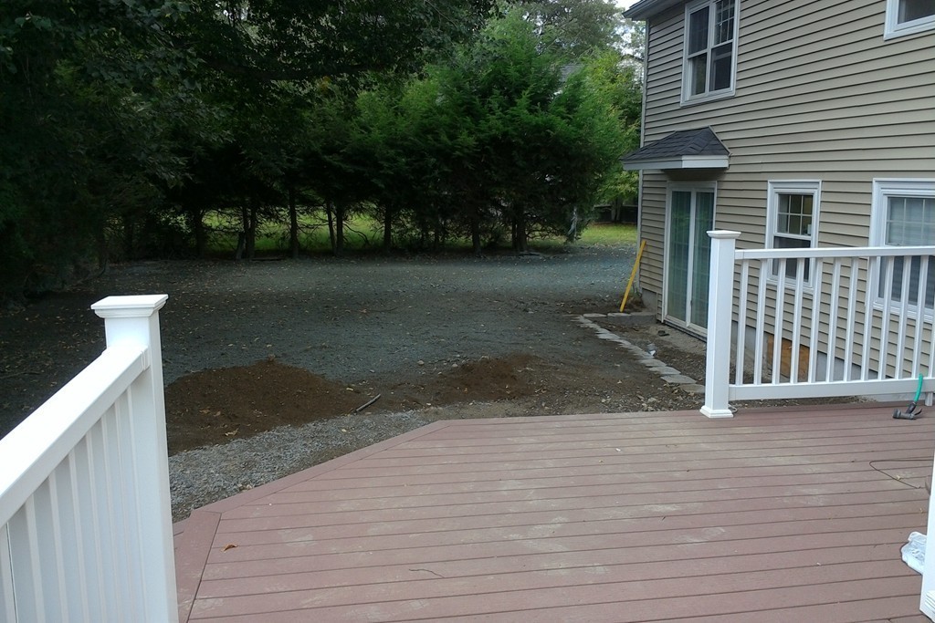 39 Dunedin Road Wellesley, MA 02481 - Photo 12 of 13 a front view of a house with a yard