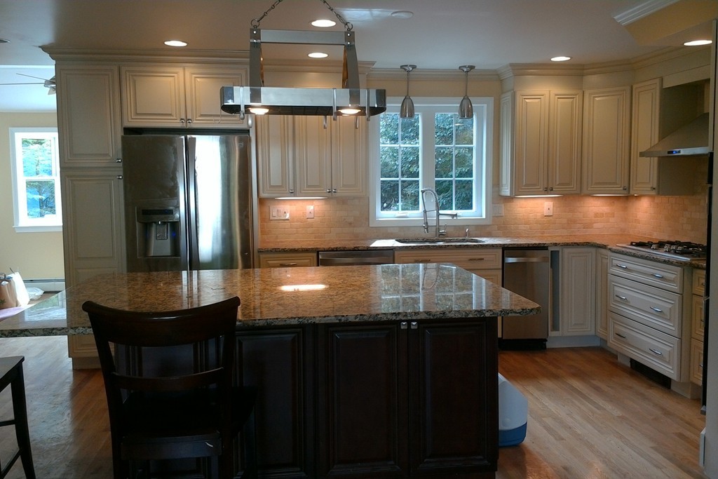 39 Dunedin Road Wellesley, MA 02481 - Photo 6 of 13 a kitchen with kitchen island granite countertop a sink and stainless steel appliances