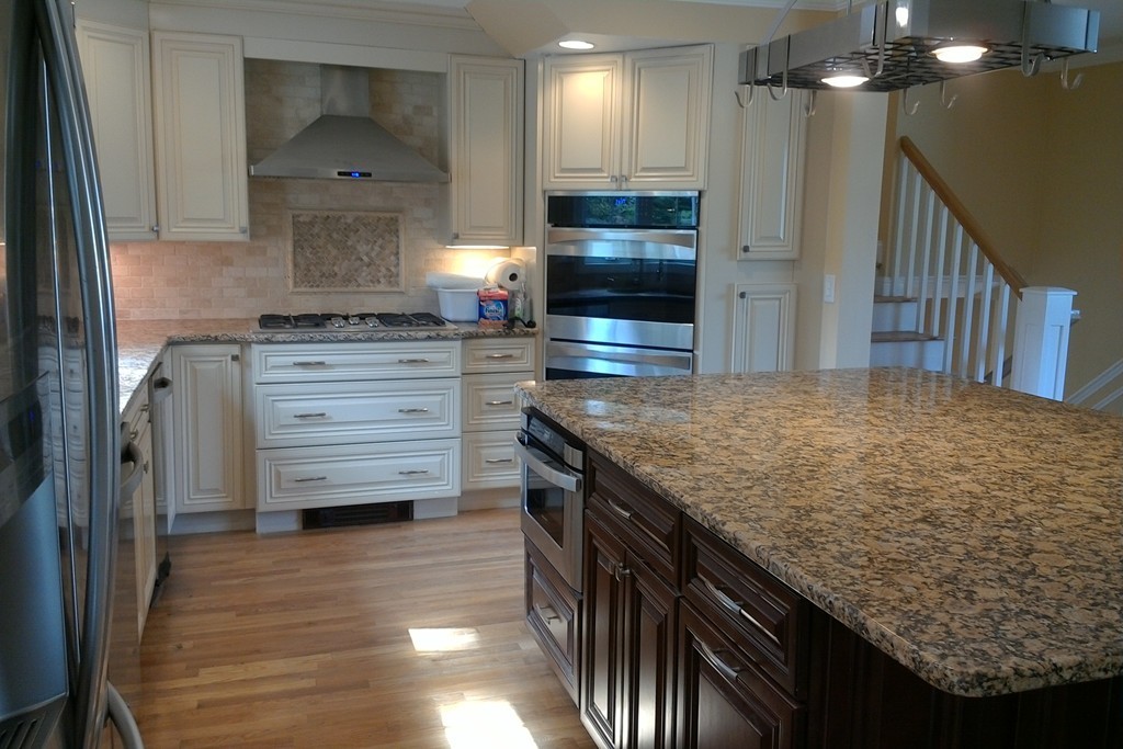 39 Dunedin Road Wellesley, MA 02481 - Photo 7 of 13 a kitchen with kitchen island a sink stainless steel appliances and cabinets
