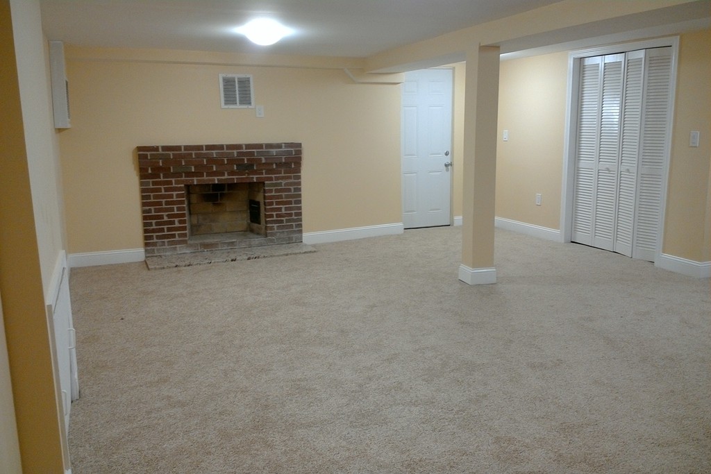 39 Dunedin Road Wellesley, MA 02481 - Photo 10 of 13 a view of empty room with a fireplace