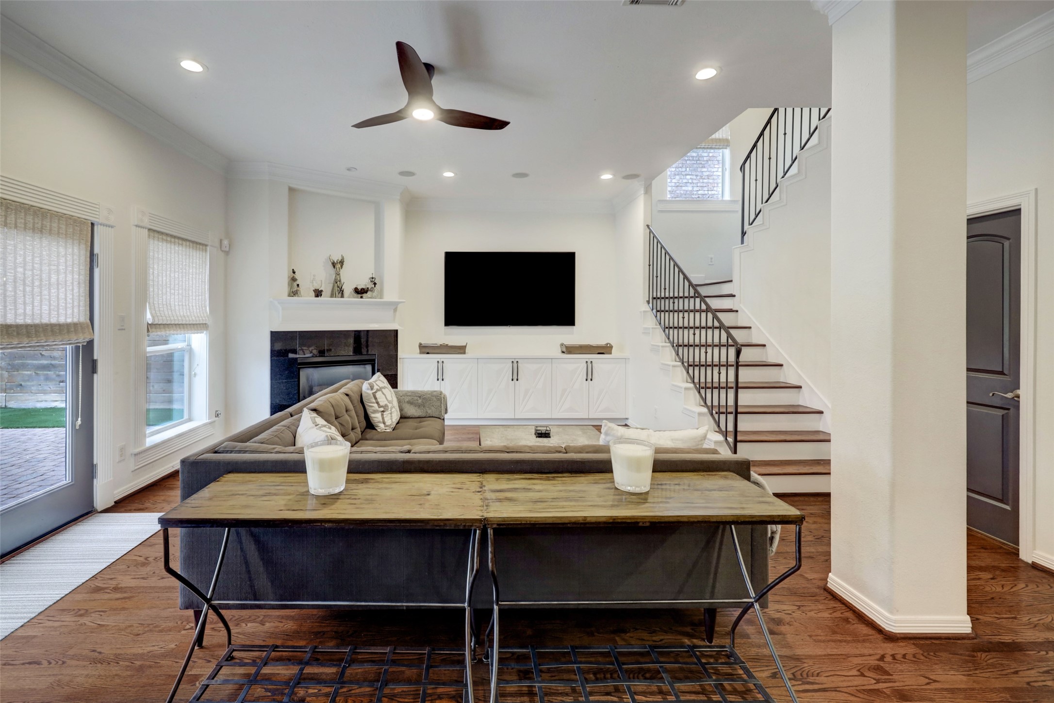 4004 Childress Street Houston, TX 77005 - Photo 15 of 34 a living room with furniture a fireplace and a flat screen tv