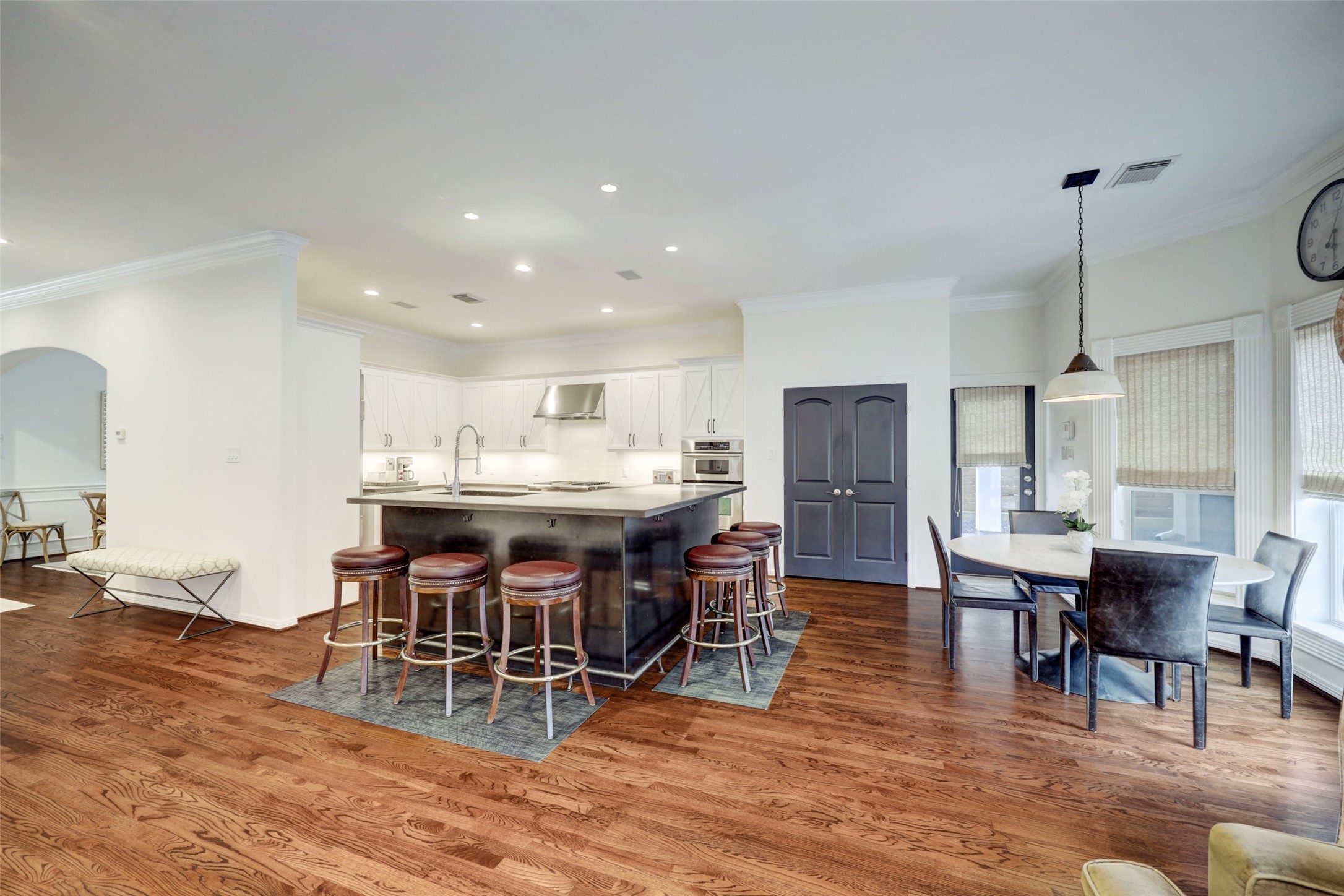 4004 Childress Street Houston, TX 77005 - Photo 18 of 34 a view of a dining room with furniture and wooden floor