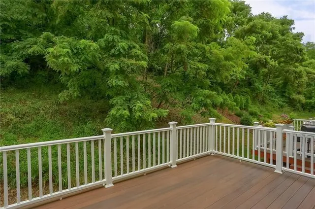 a view of a balcony with wooden floor