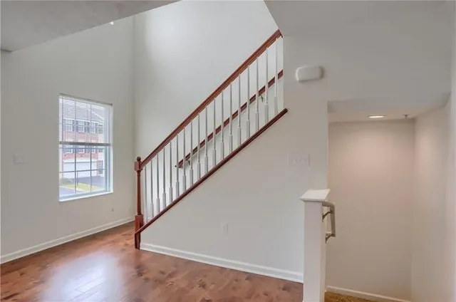 a view of an entryway with wooden floor