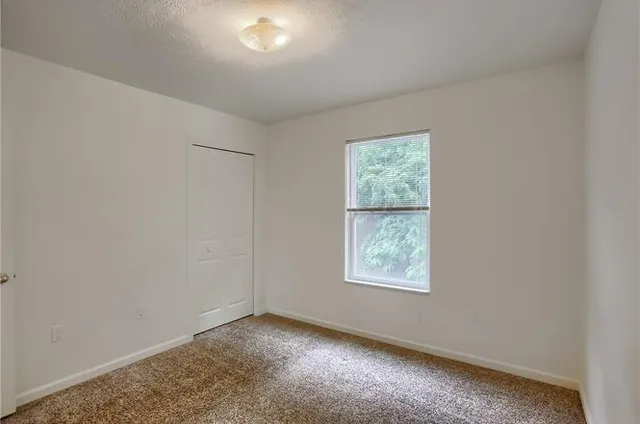 an empty room with windows