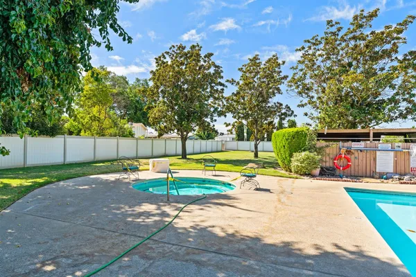 a view of a swimming pool with a patio