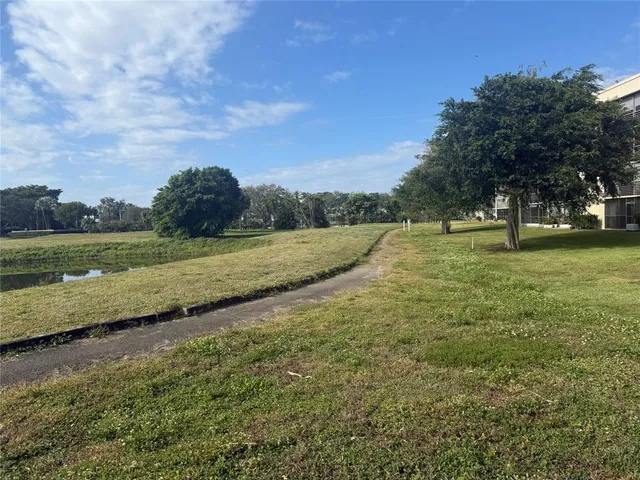a view of a field with an trees