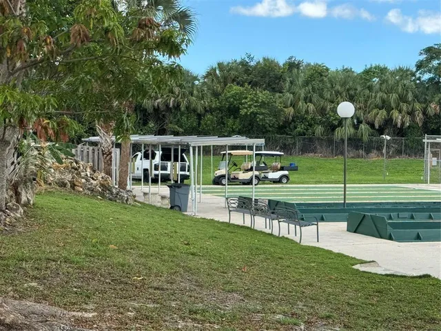 a view of house with a big yard