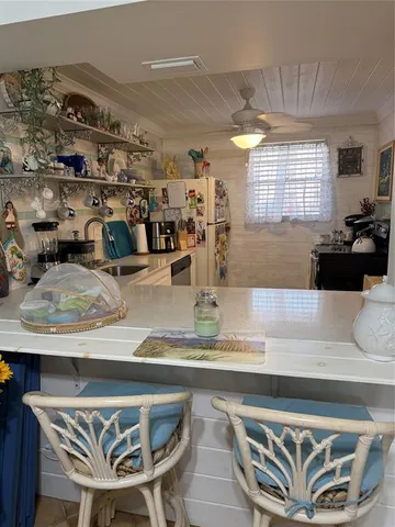 a kitchen with a table and chairs in it