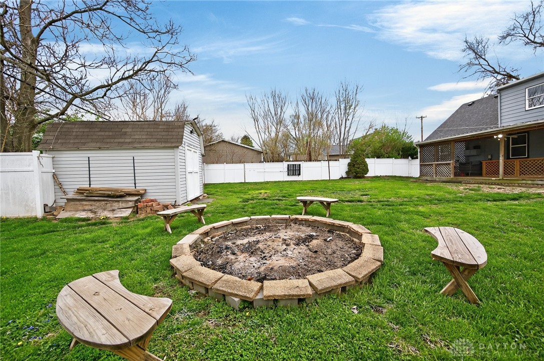 3301 Wildwood Road Middletown, OH 45042 - Photo 53 of 68 This spacious yard offers a dedicated fire pit and a convenient storage shed.