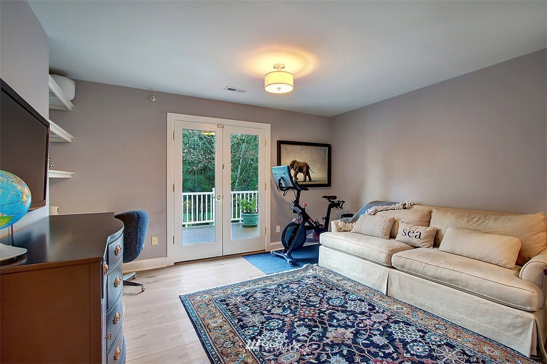 6615 Cultus Bay Road Clinton, WA 98236 - Photo 14 of 25 a living room with furniture and a window