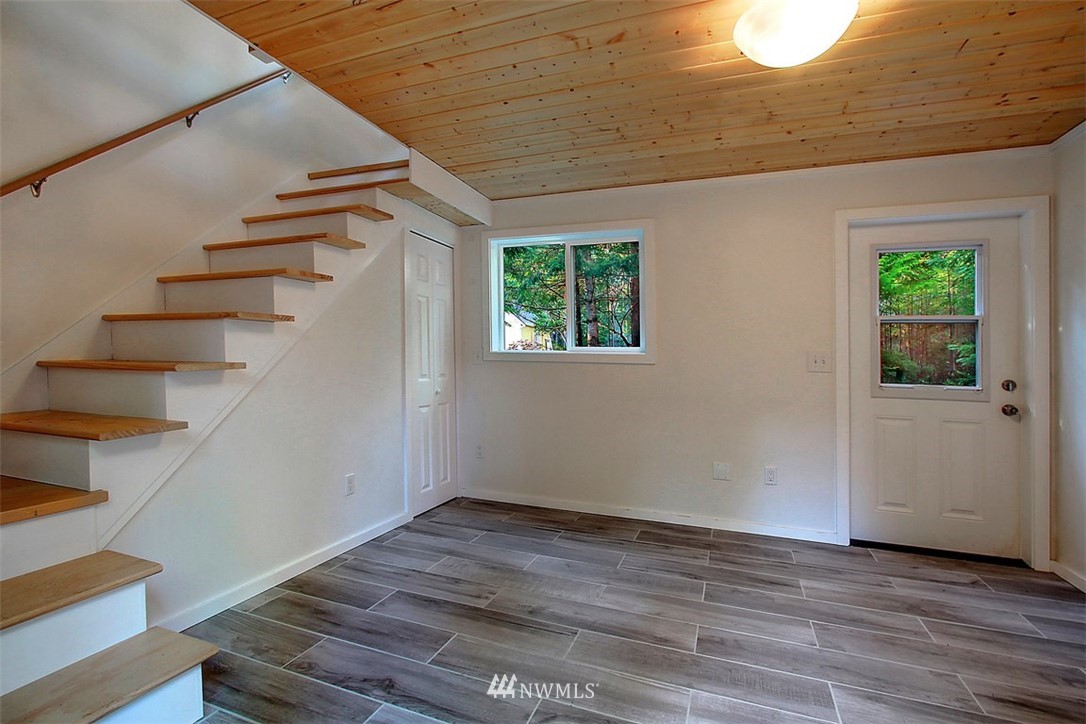 6615 Cultus Bay Road Clinton, WA 98236 - Photo 19 of 25 a view of entryway and hall with wooden floor