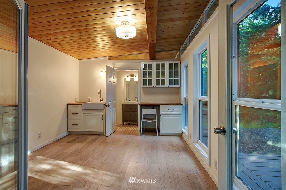 6615 Cultus Bay Road Clinton, WA 98236 - Photo 20 of 25 a view of a kitchen with a refrigerator and a stove