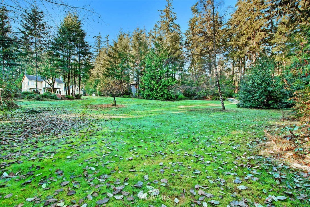 6615 Cultus Bay Road Clinton, WA 98236 - Photo 22 of 25 a green field with lots of bushes