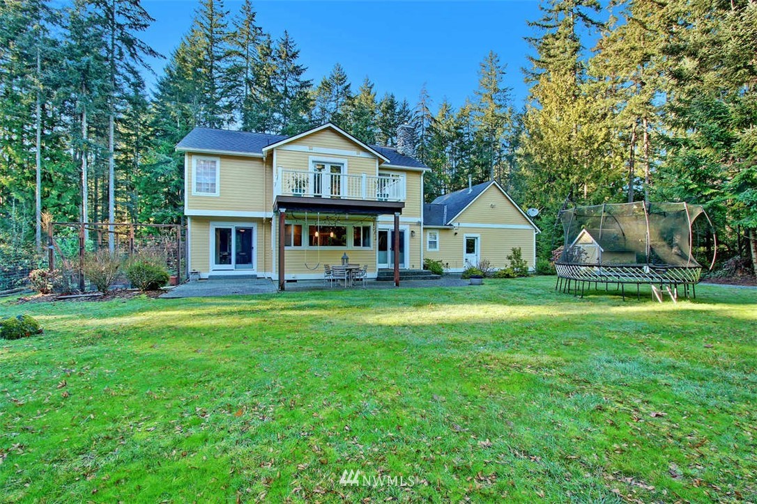 6615 Cultus Bay Road Clinton, WA 98236 - Photo 23 of 25 a front view of a house with yard and green space