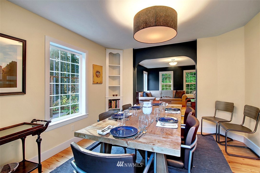 6615 Cultus Bay Road Clinton, WA 98236 - Photo 7 of 25 a view of a dining room with furniture and window