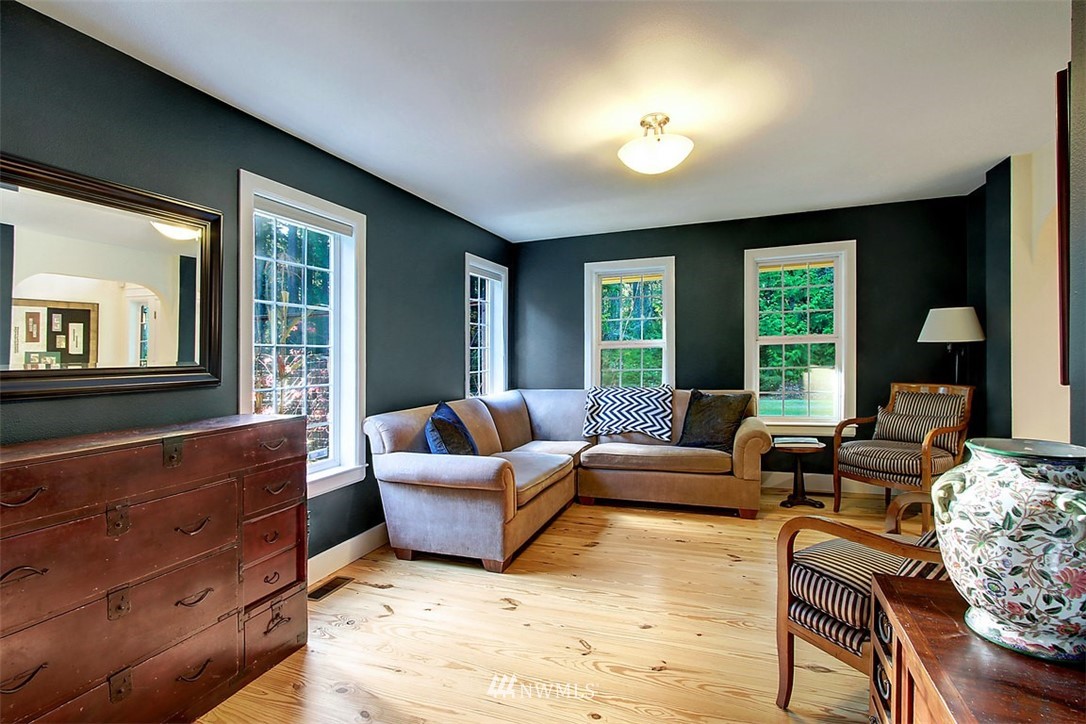 6615 Cultus Bay Road Clinton, WA 98236 - Photo 8 of 25 a living room with furniture and a large window