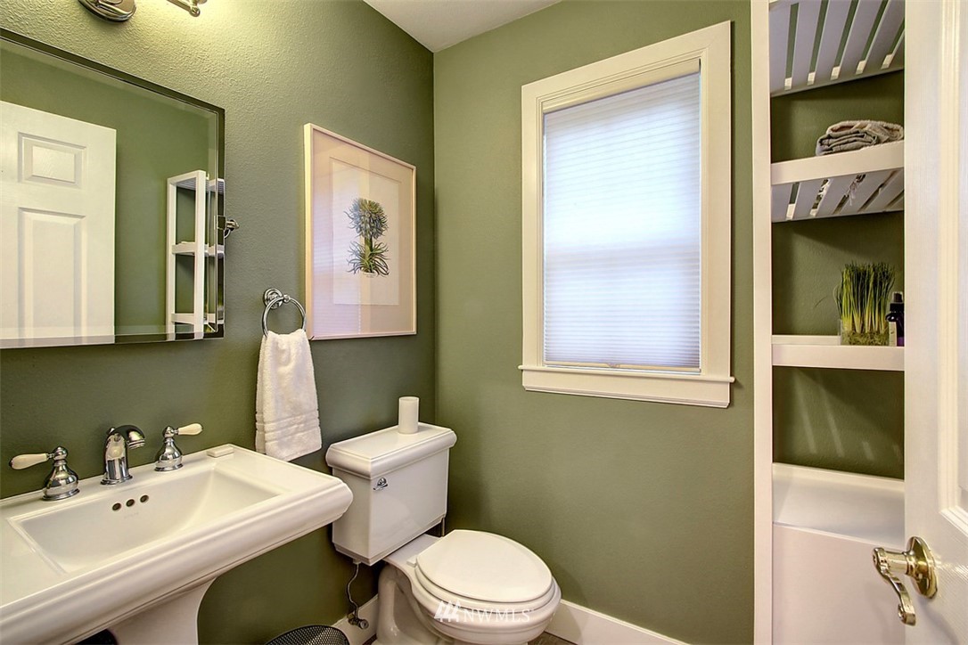 6615 Cultus Bay Road Clinton, WA 98236 - Photo 10 of 25 a bathroom with a sink a toilet and shower
