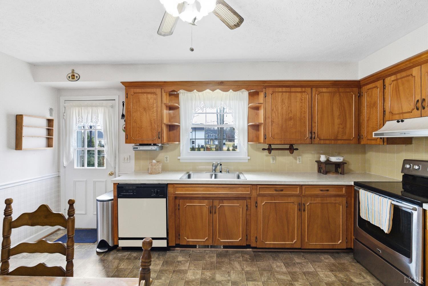 14 Sleepy Hollow Road Lynchburg, VA 24502 - Photo 11 of 35 a kitchen with a sink stove and cabinets