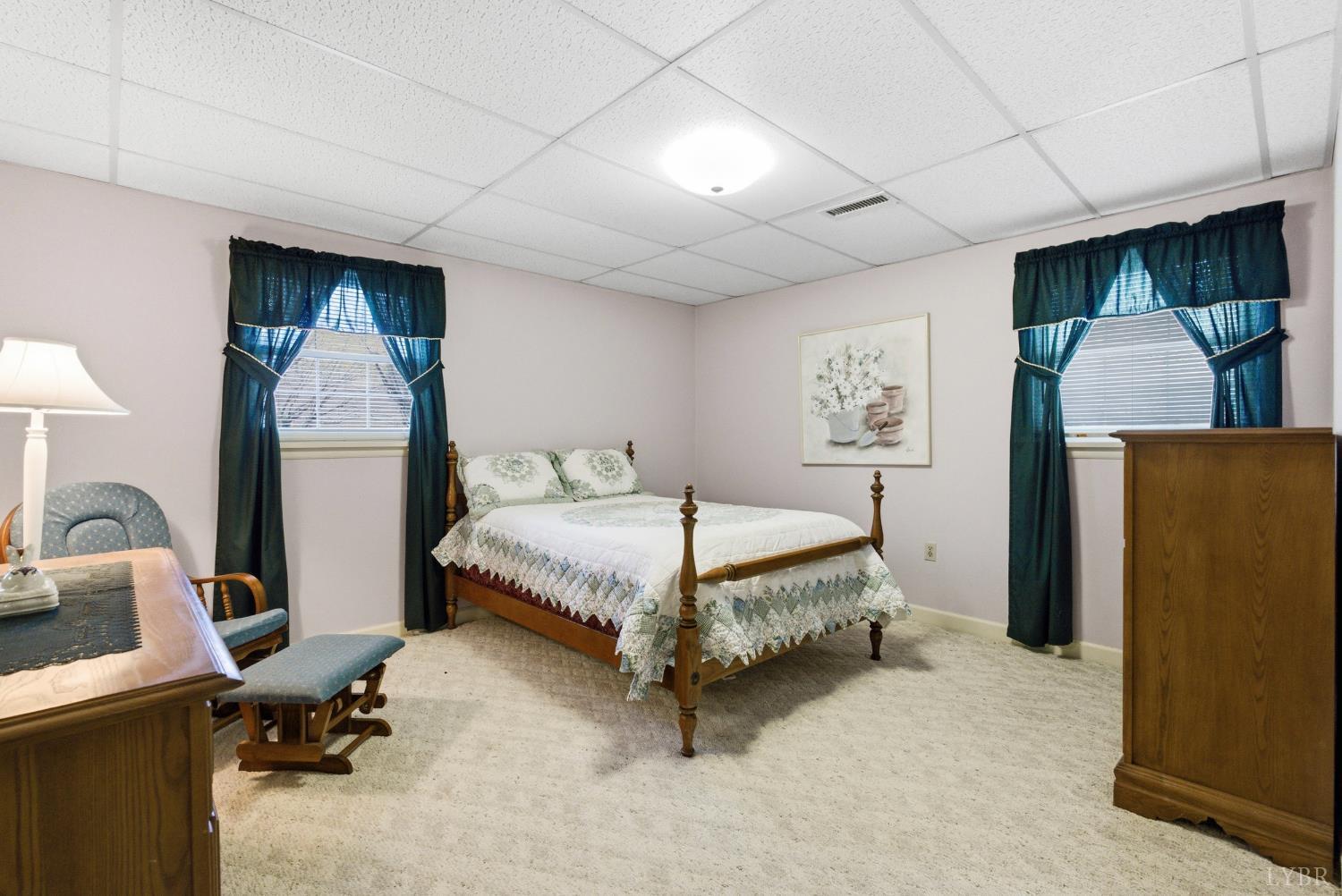 14 Sleepy Hollow Road Lynchburg, VA 24502 - Photo 20 of 35 a spacious bedroom with a bed and a desk