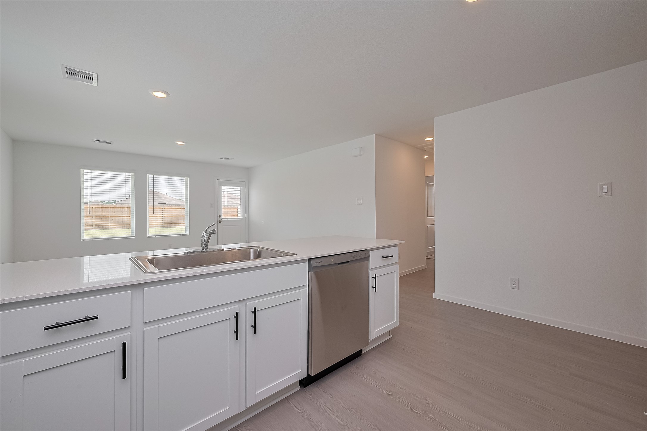 21459 Montecagnano Avenue New Caney, TX 77357 - Photo 13 of 27 a kitchen with sink and window