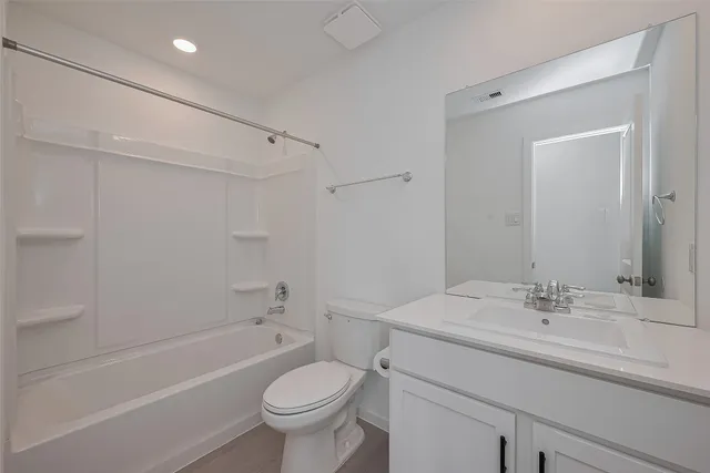 a bathroom with a sink a toilet and a bathtub