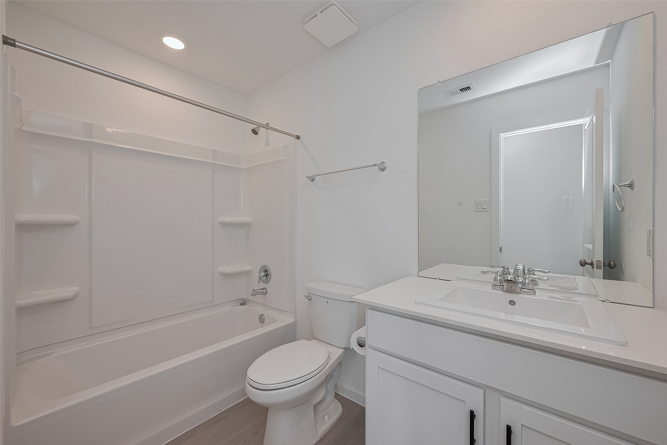 21459 Montecagnano Avenue New Caney, TX 77357 - Photo 15 of 27 a bathroom with a sink a toilet and a bathtub