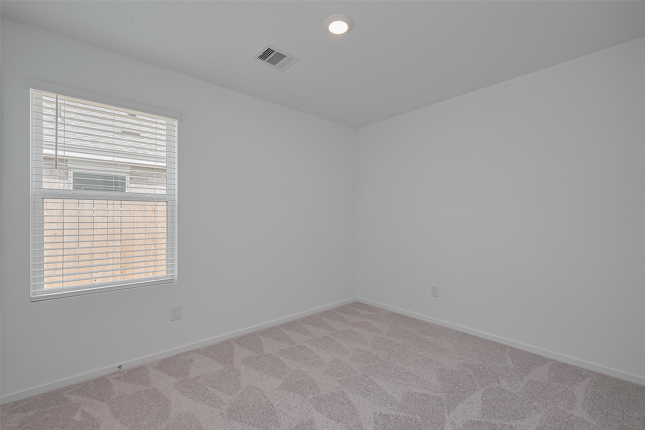 21459 Montecagnano Avenue New Caney, TX 77357 - Photo 17 of 27 an empty room with a window