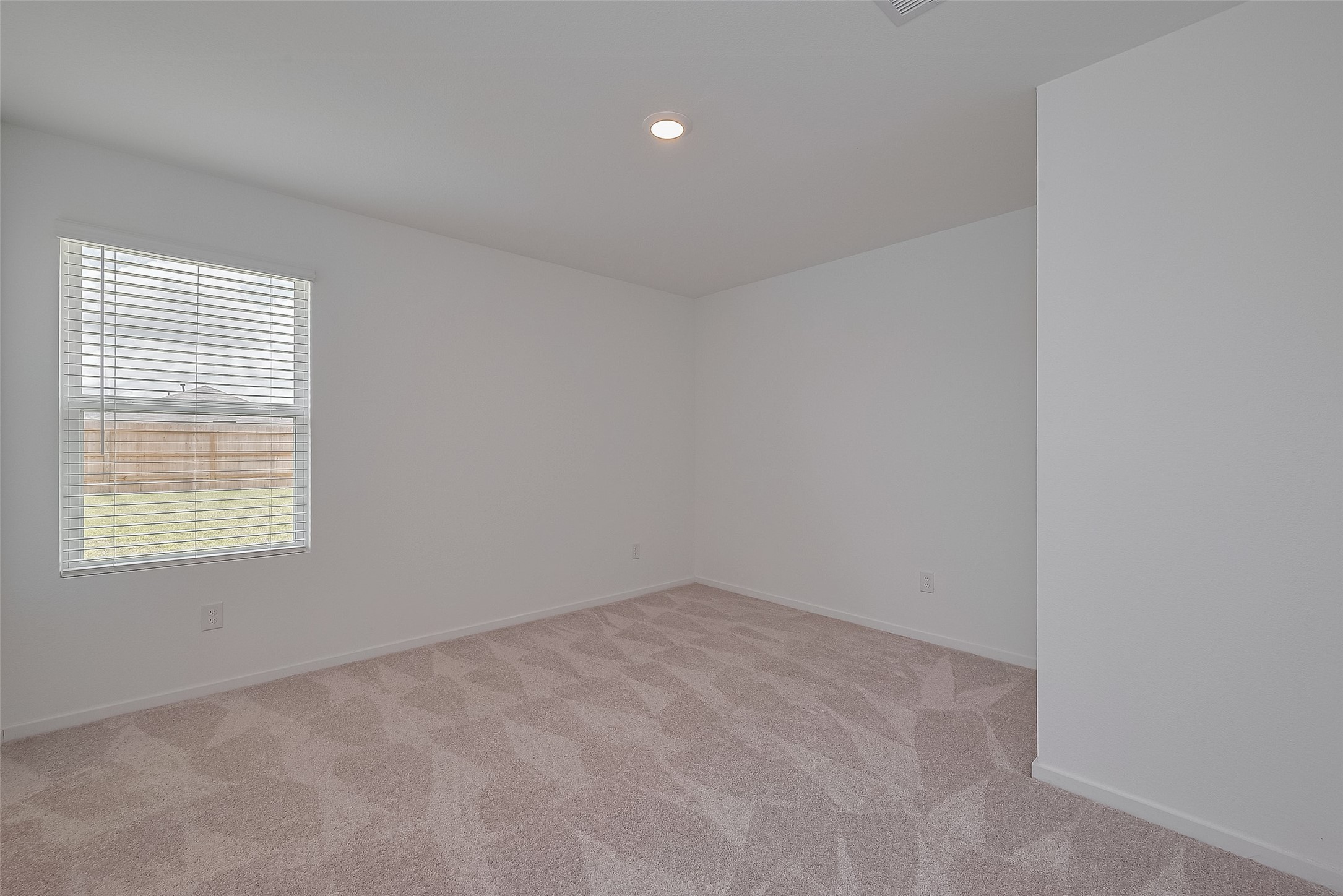 21459 Montecagnano Avenue New Caney, TX 77357 - Photo 18 of 27 an empty room with a window