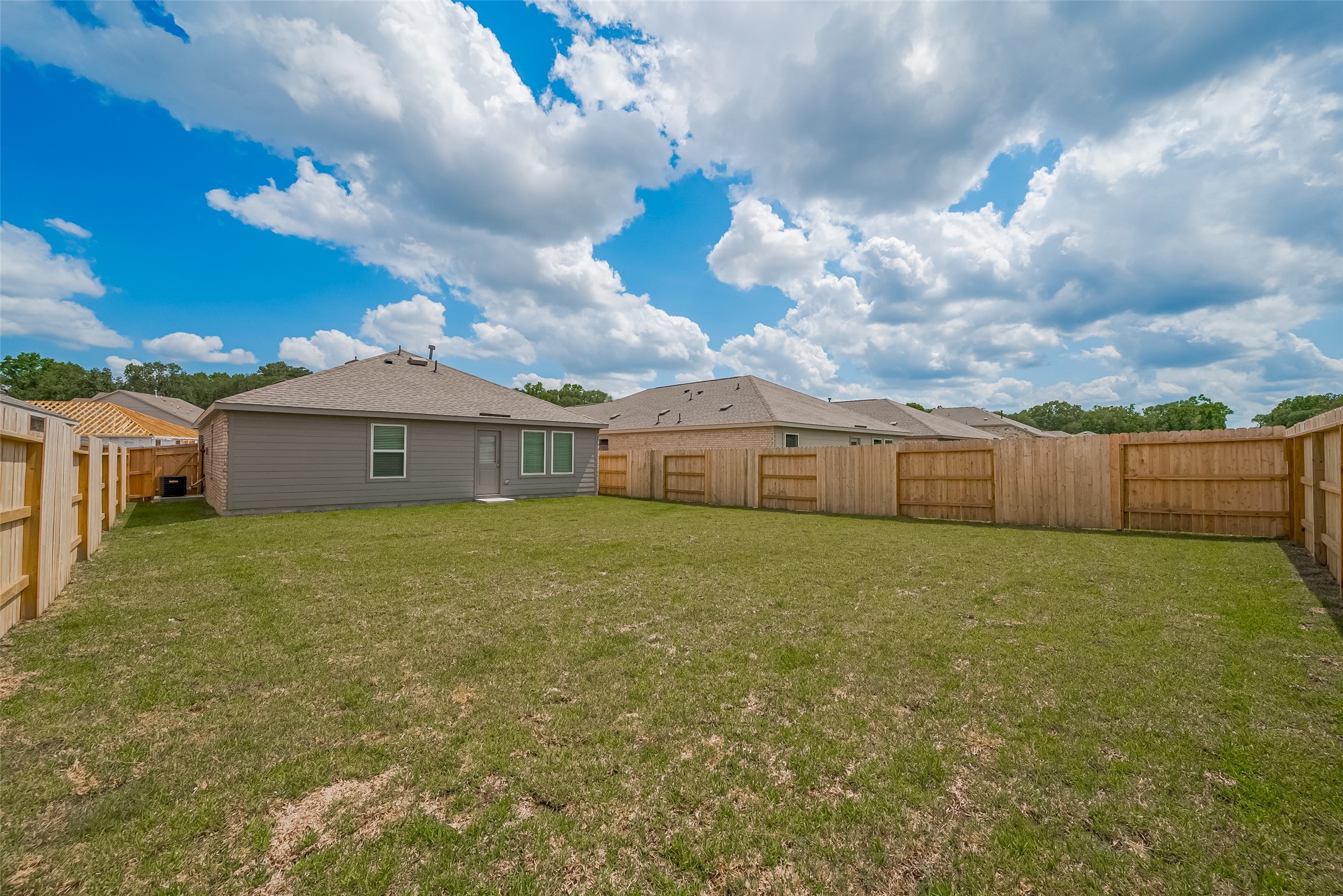 21459 Montecagnano Avenue New Caney, TX 77357 - Photo 27 of 27 a front view of house with yard