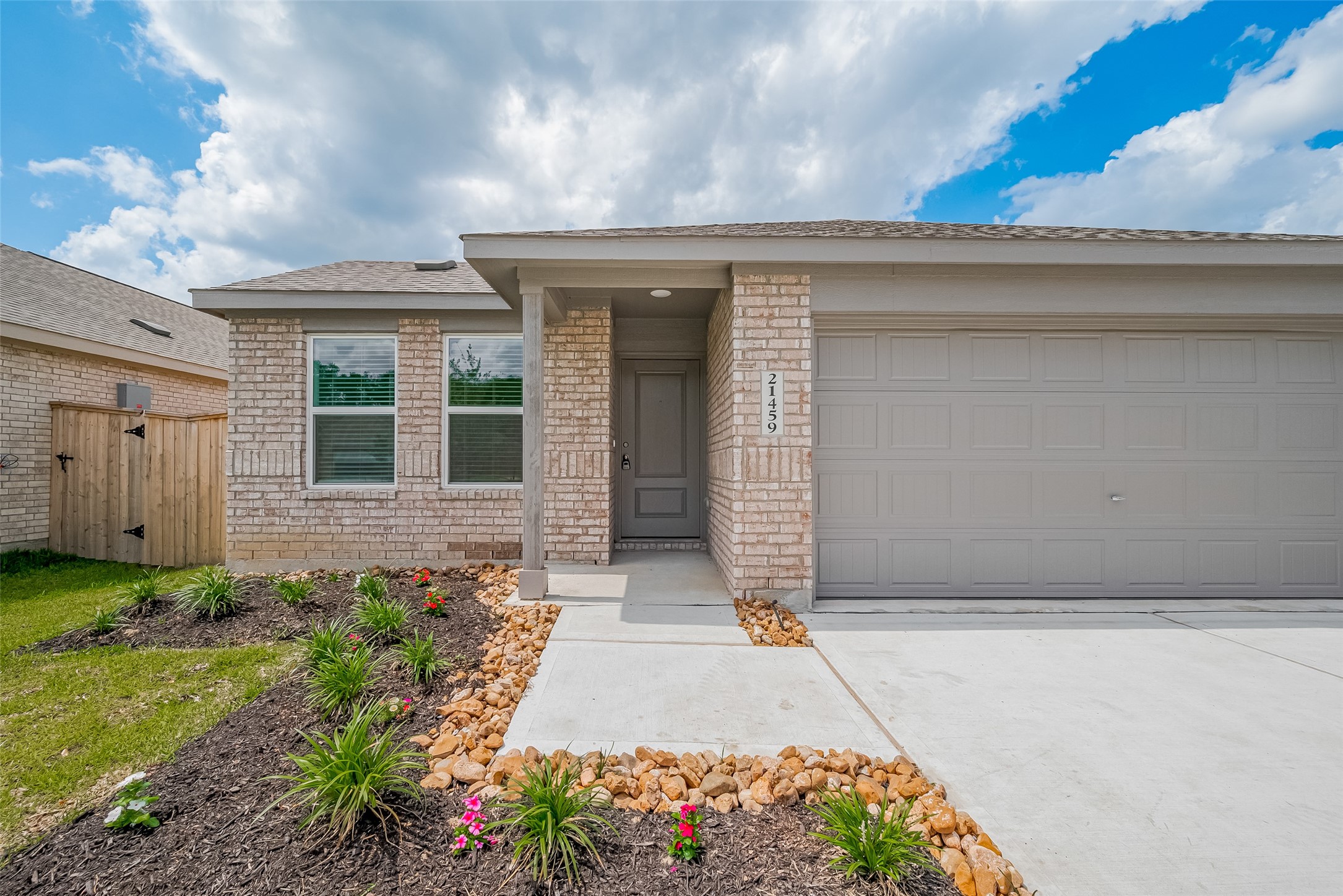 21459 Montecagnano Avenue New Caney, TX 77357 - Photo 4 of 27 a entryway with flower pots