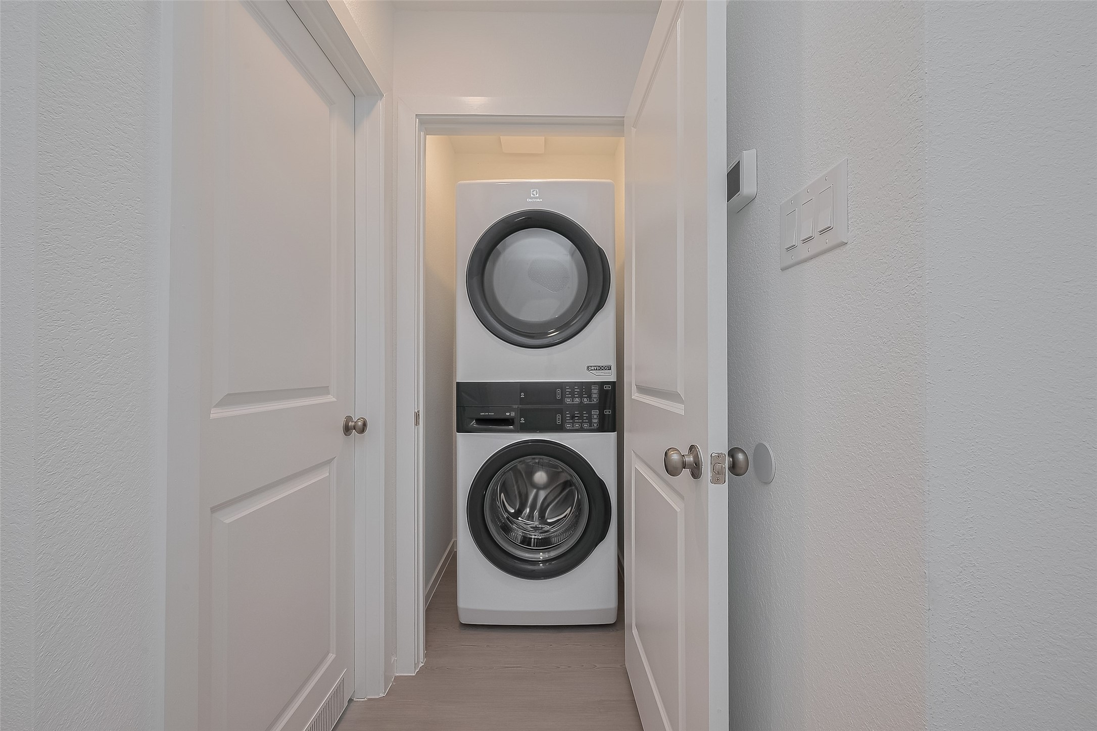 21459 Montecagnano Avenue New Caney, TX 77357 - Photo 6 of 27 a utility room with dryer and washer