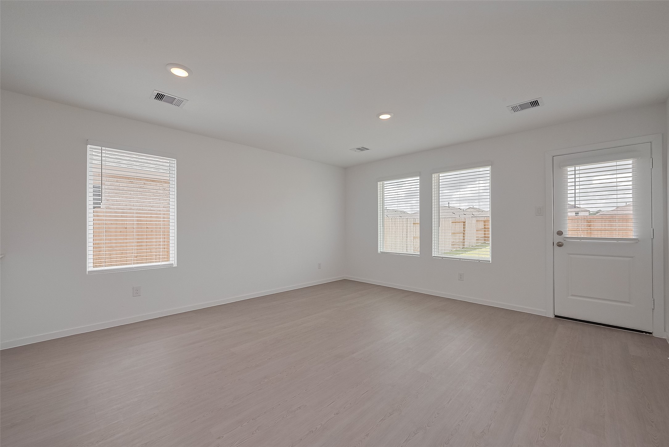 21459 Montecagnano Avenue New Caney, TX 77357 - Photo 7 of 27 a view of an empty room with a window