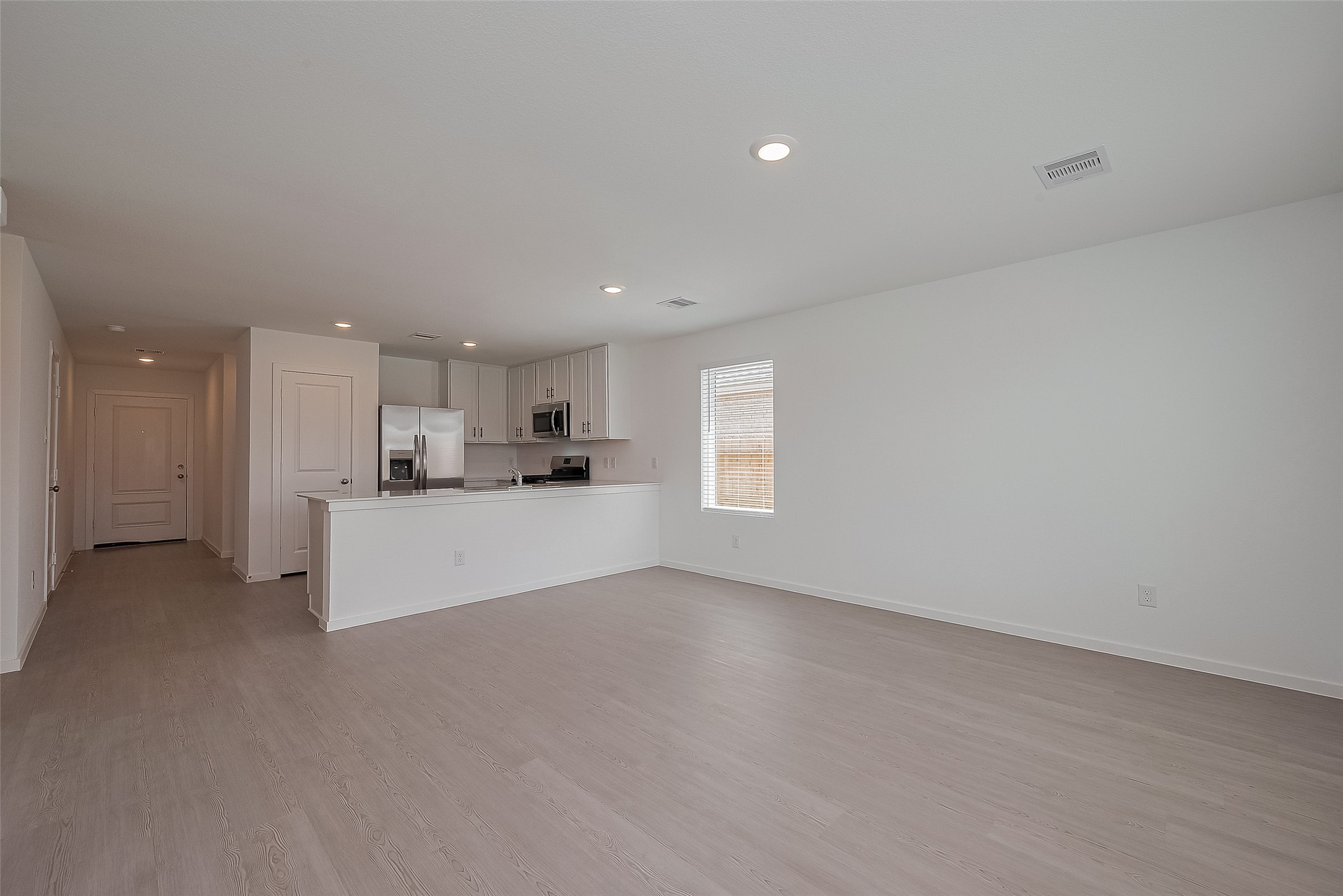 21459 Montecagnano Avenue New Caney, TX 77357 - Photo 8 of 27 a view of kitchen and kitchen with window