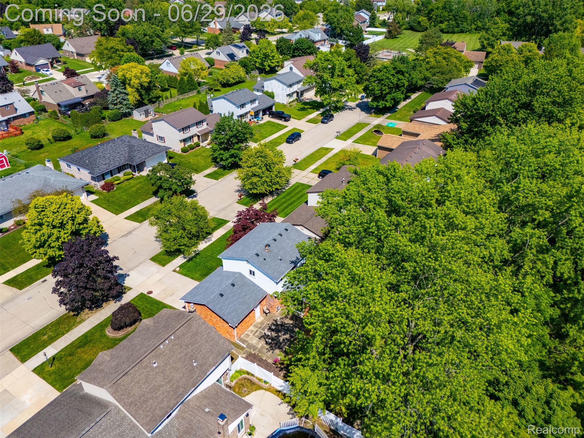 45179 Rudgate Road Canton, MI 48188 - Photo 37 of 48 Aerial perspective of a residential neighborhood featuring established homes with diverse architectural styles, mature trees, and manicured lawns