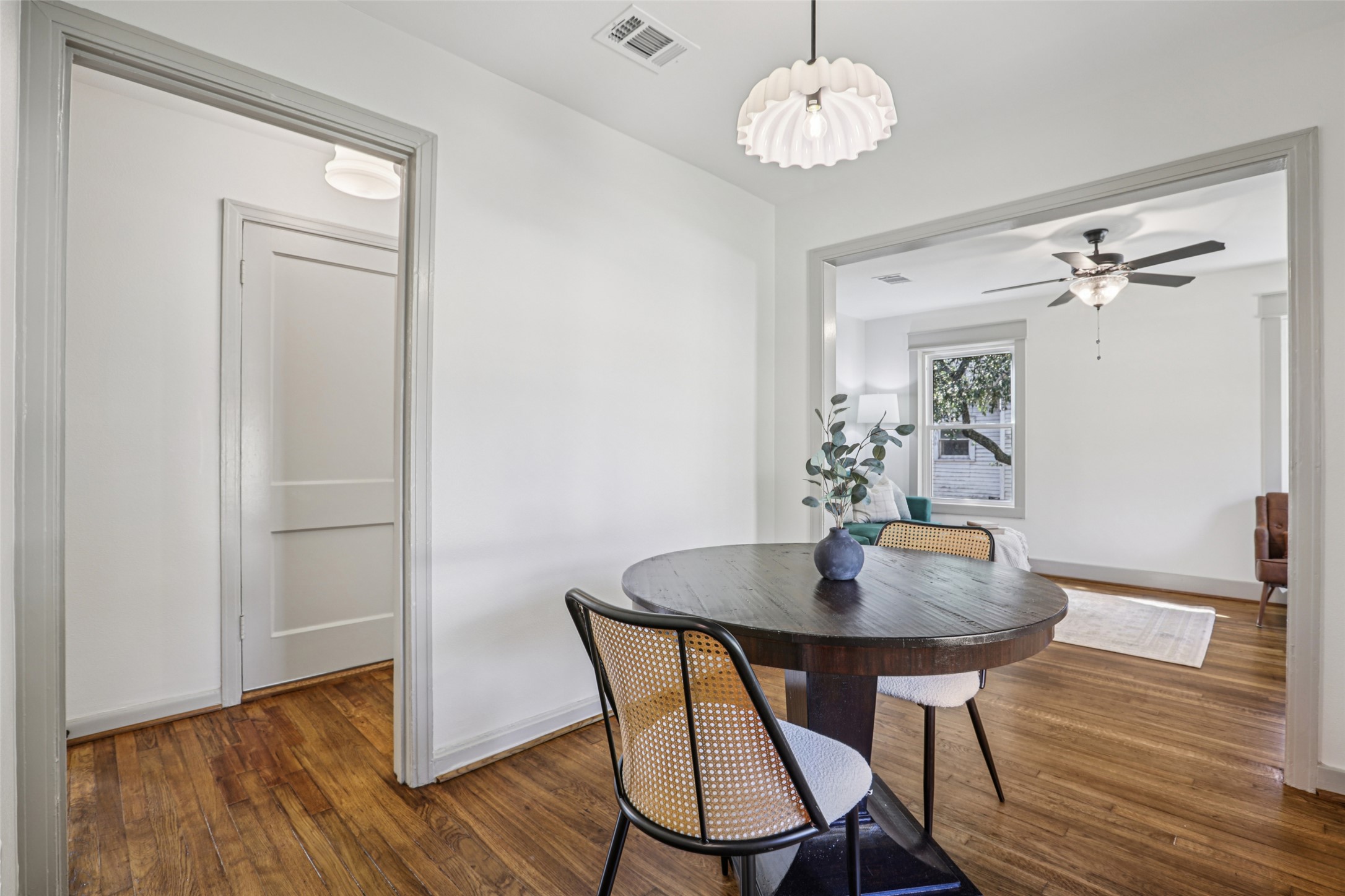 602 Short Street Smithville, TX 78957 - Photo 13 of 27 a view of a dining room with furniture wooden floor and a chandelier
