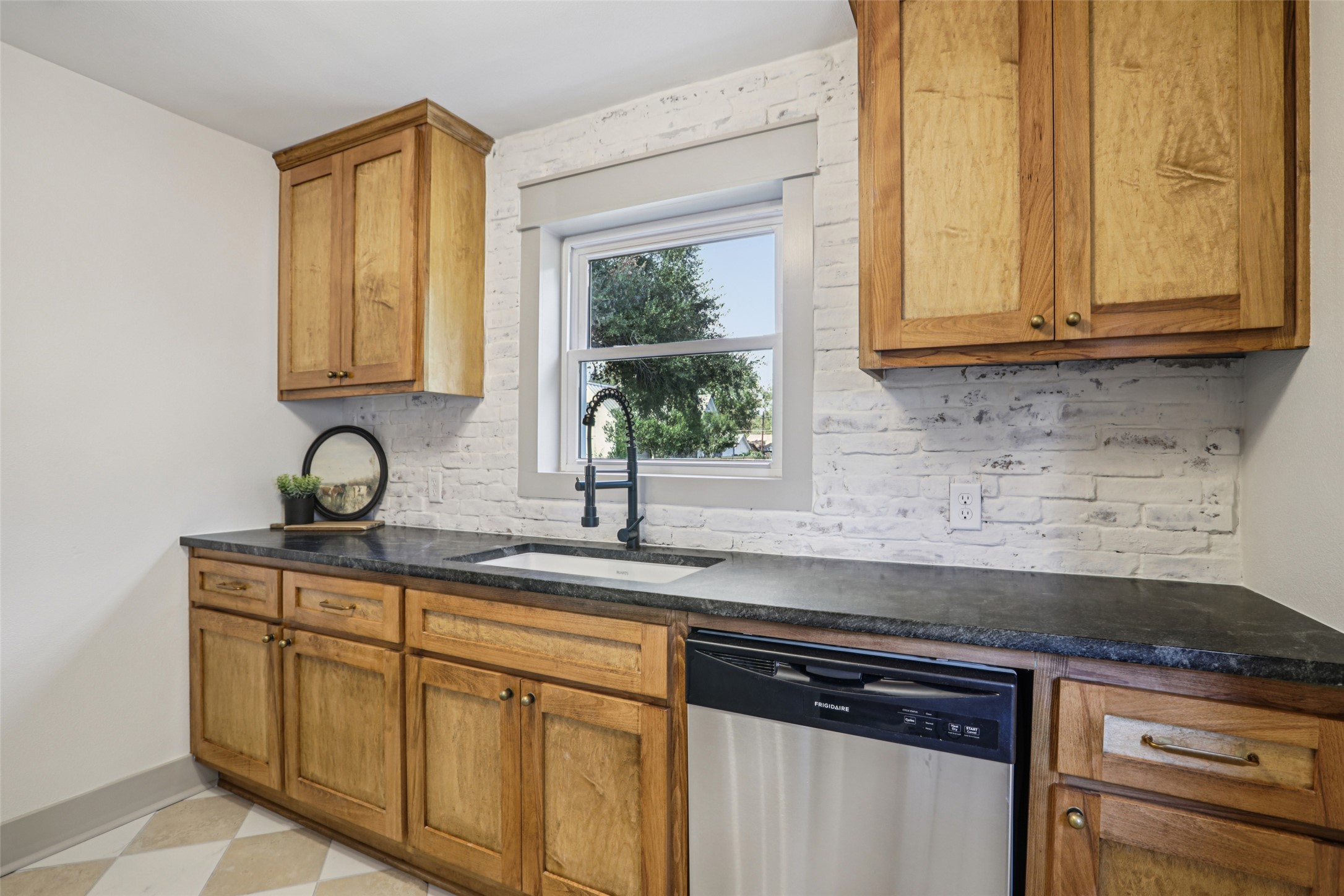 602 Short Street Smithville, TX 78957 - Photo 18 of 27 a kitchen with stainless steel appliances granite countertop white cabinets and a granite counter tops