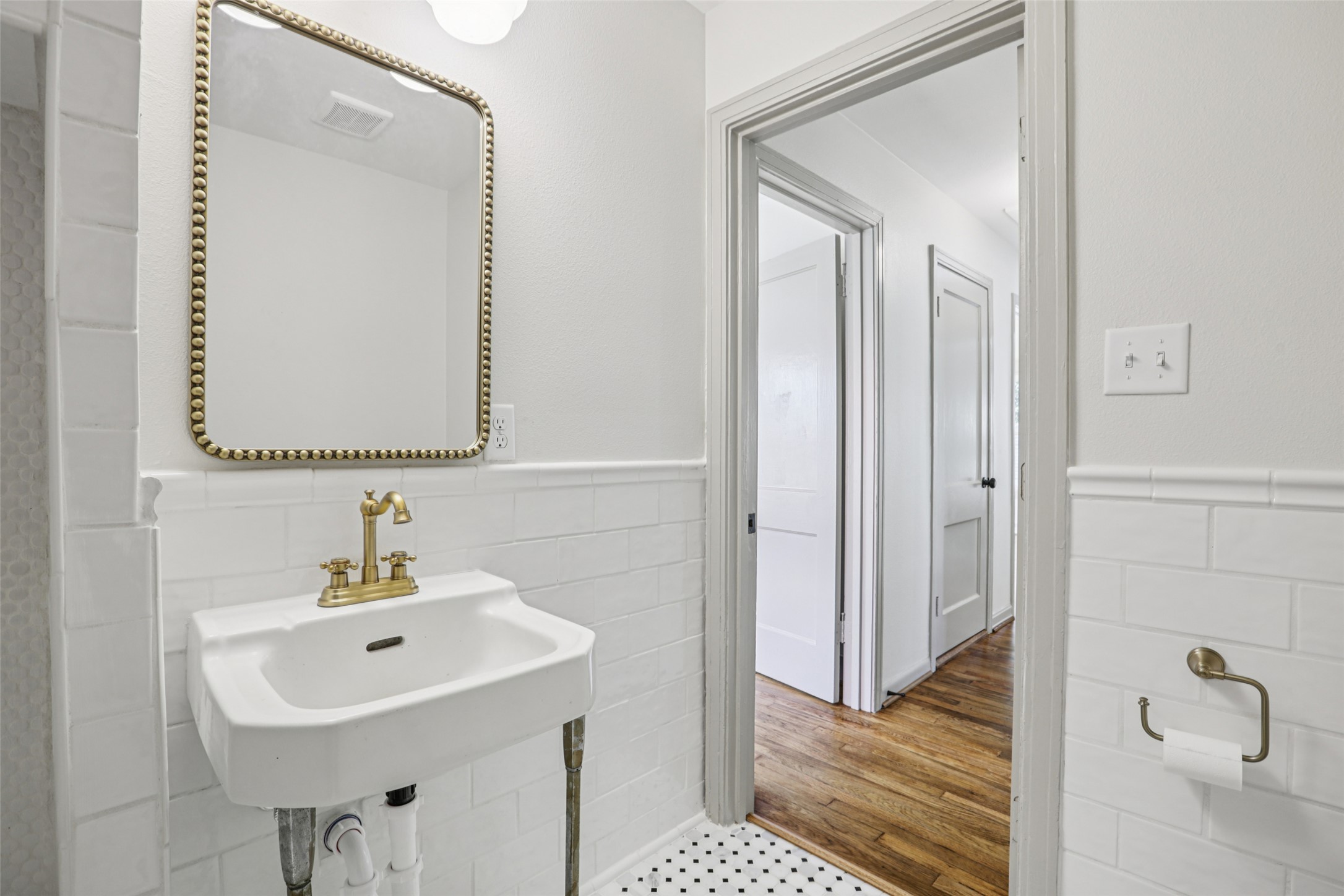 602 Short Street Smithville, TX 78957 - Photo 21 of 27 a bathroom with a sink a mirror and a shower