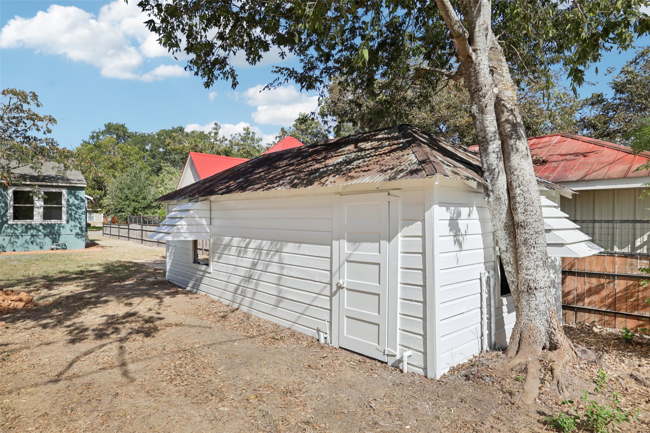 602 Short Street Smithville, TX 78957 - Photo 26 of 27 a view of a house with a yard