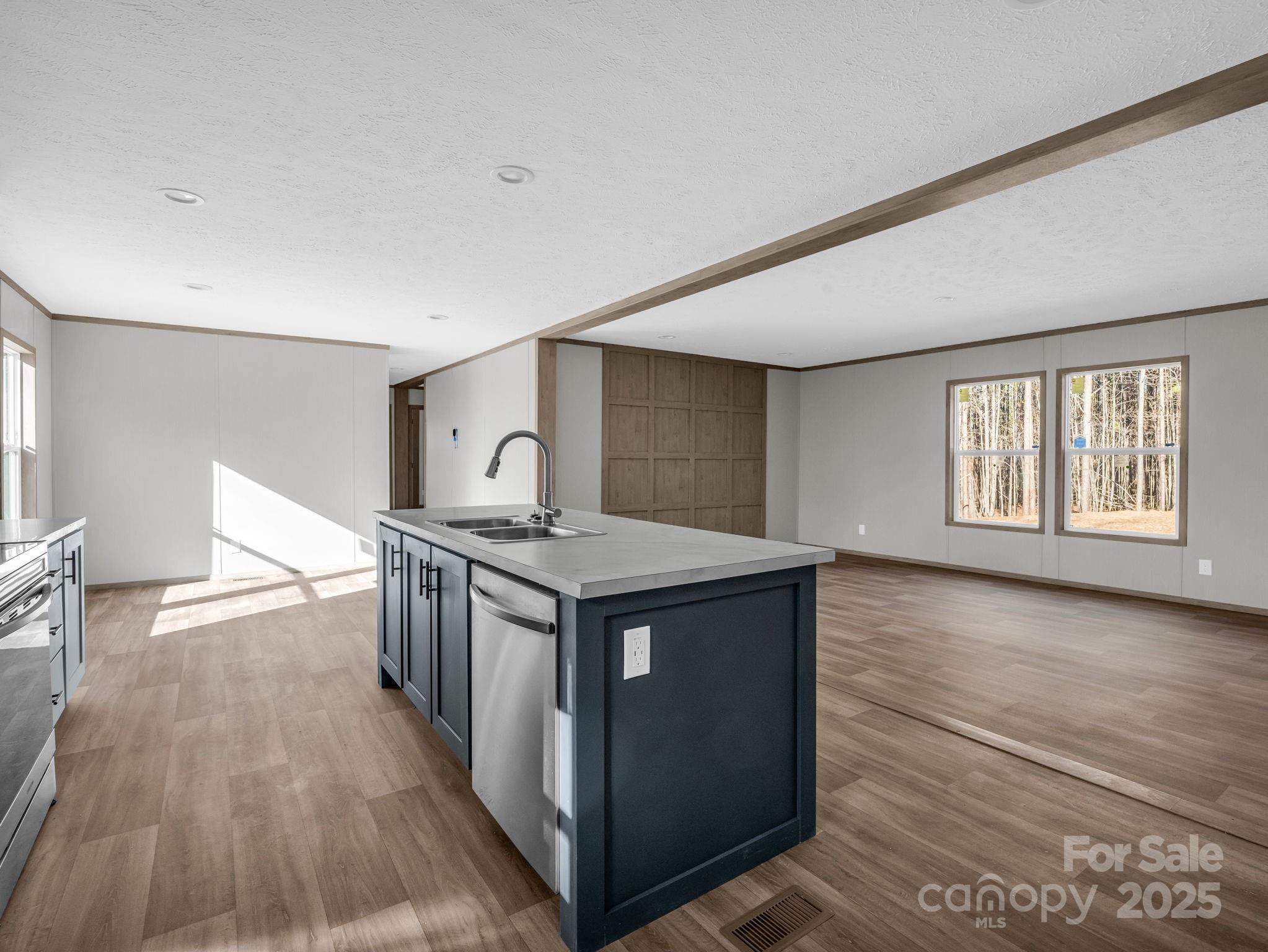 844 Tiney Road Ellenboro, NC 28040 - Photo 11 of 45 a kitchen with a stove and wooden floor