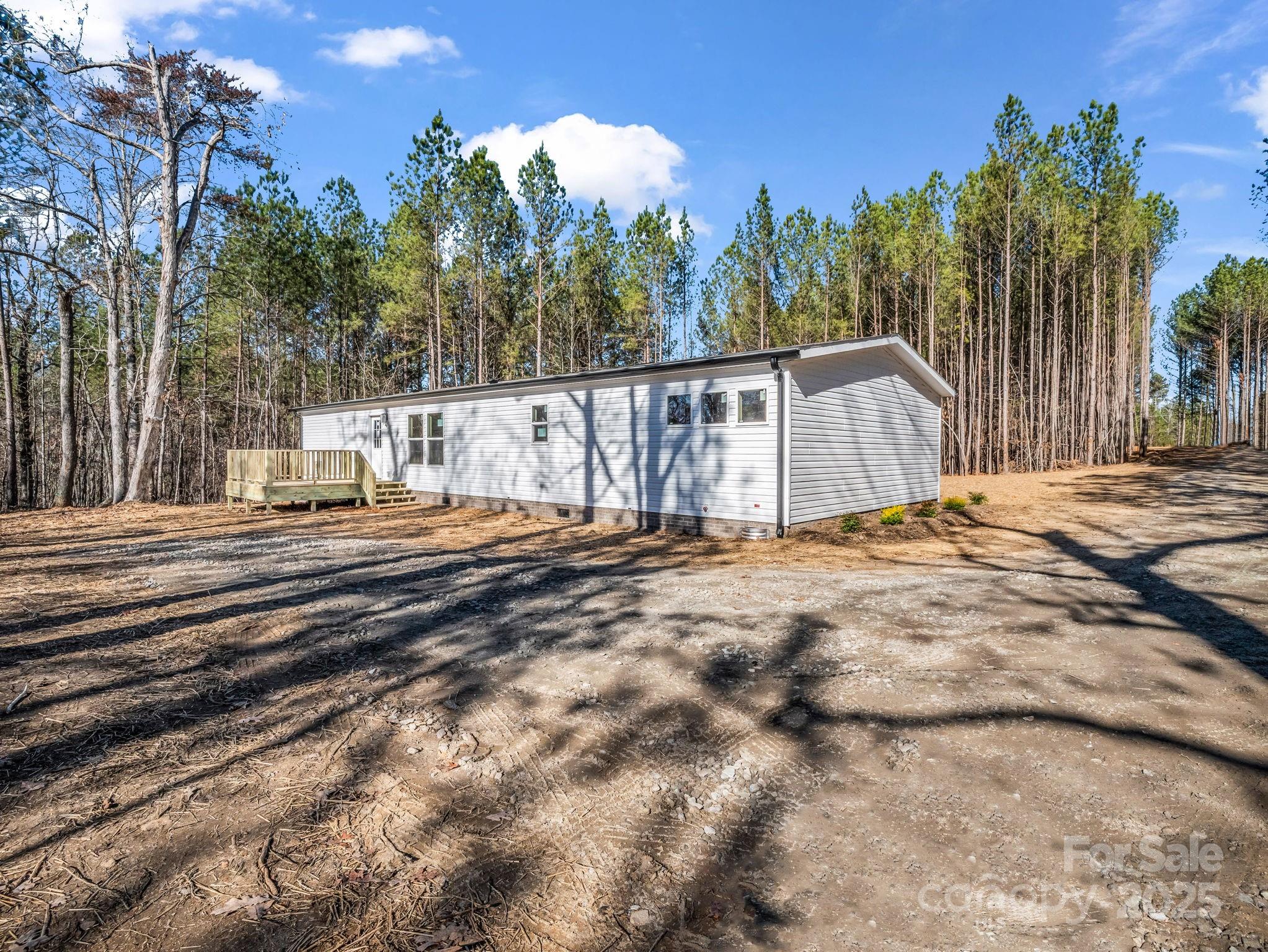 844 Tiney Road Ellenboro, NC 28040 - Photo 32 of 45 a view of backyard with wooden fence and trees