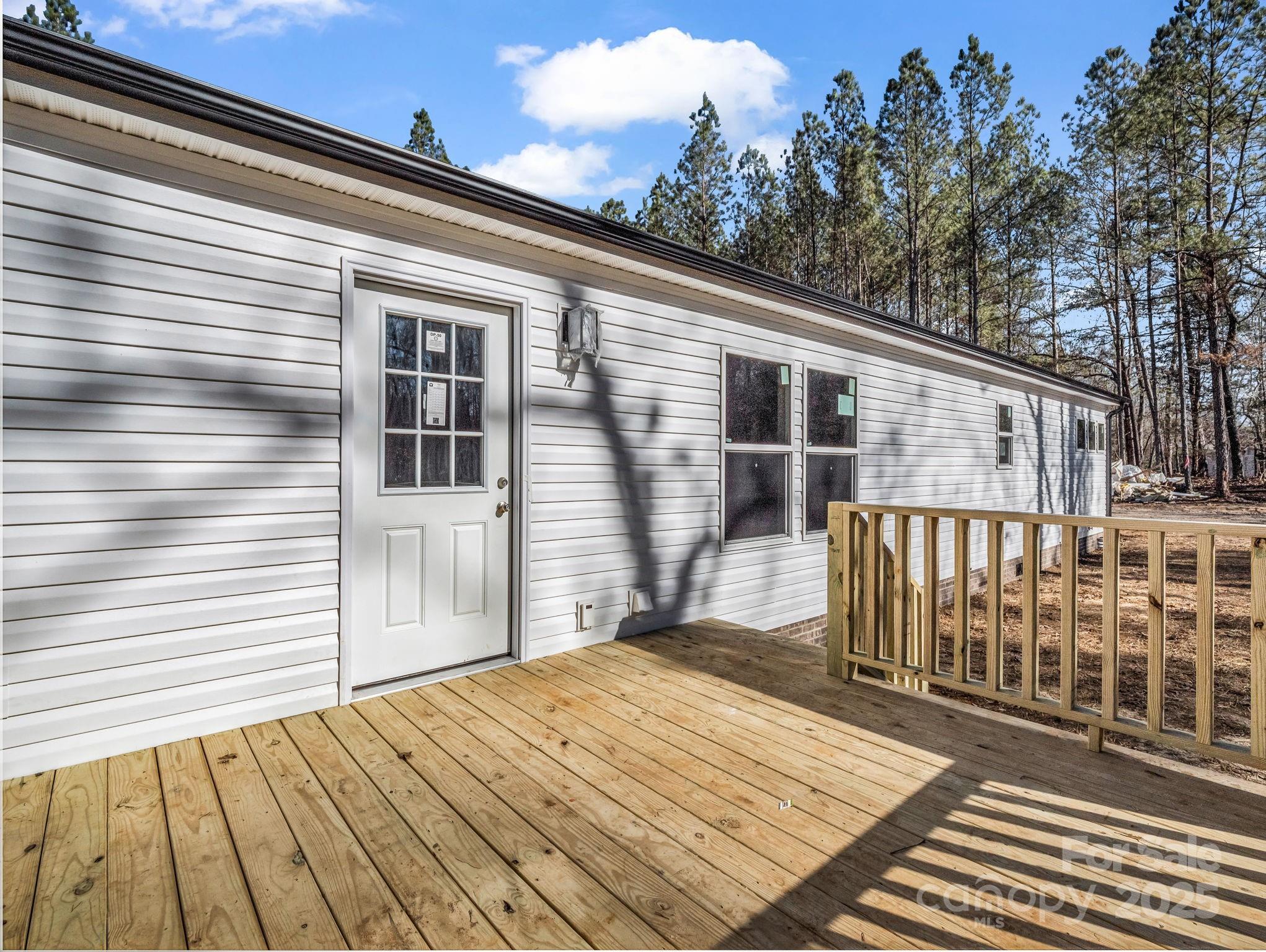 844 Tiney Road Ellenboro, NC 28040 - Photo 34 of 45 a view of a house with a roof deck