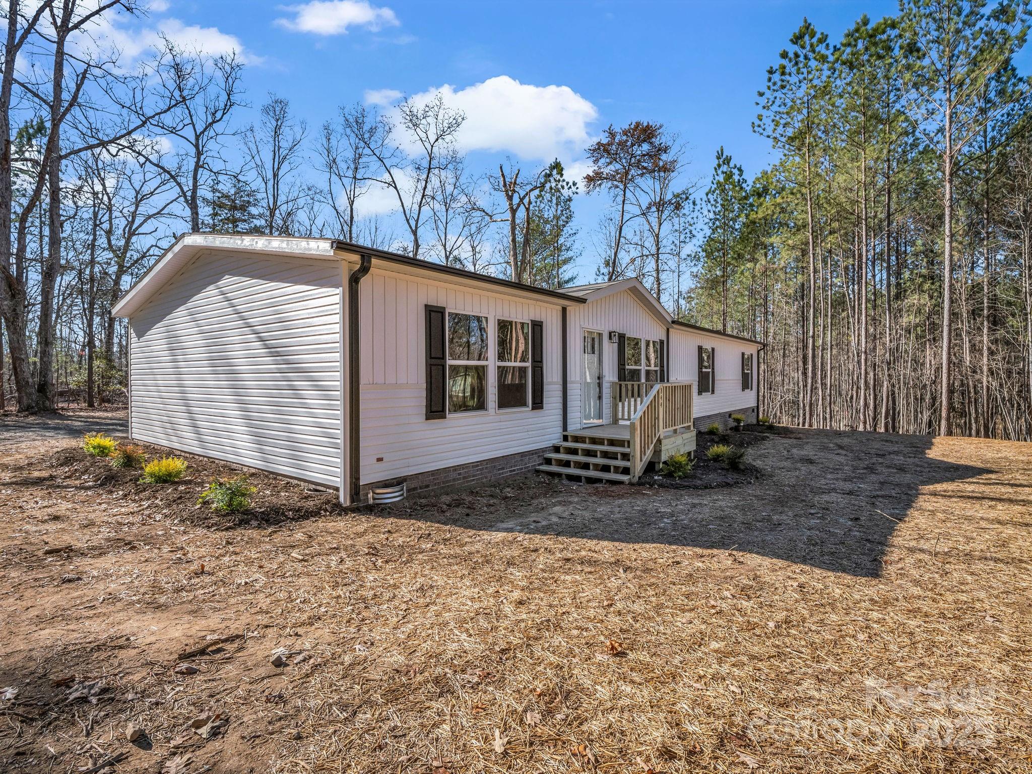 844 Tiney Road Ellenboro, NC 28040 - Photo 35 of 45 a view of a house with a yard