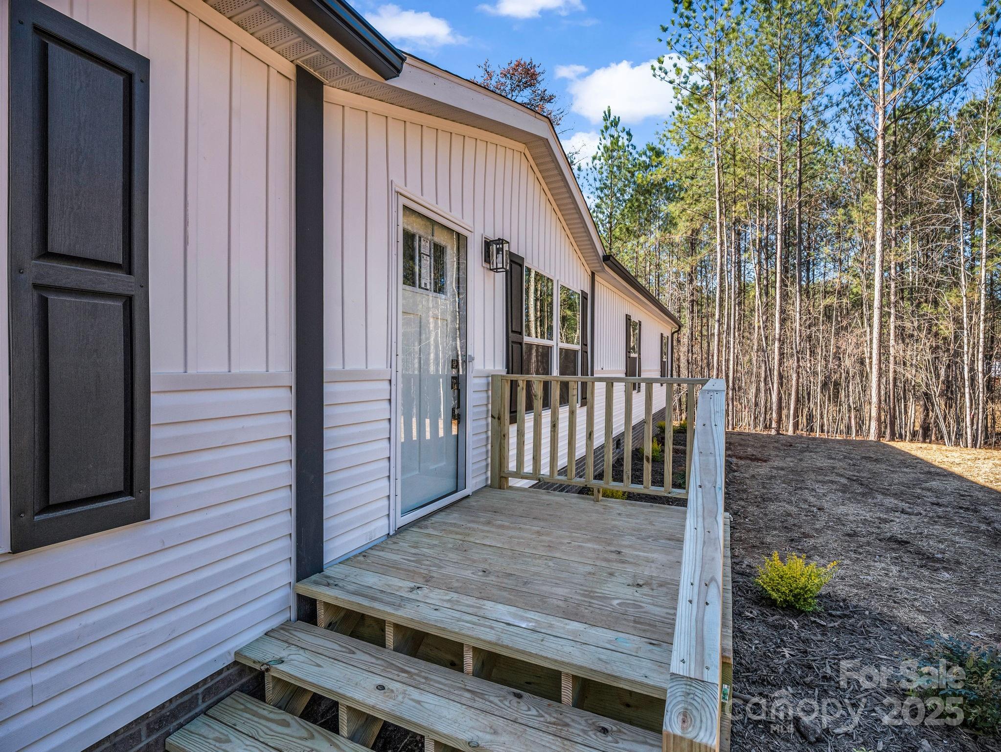 844 Tiney Road Ellenboro, NC 28040 - Photo 36 of 45 a view of a wooden deck front of house