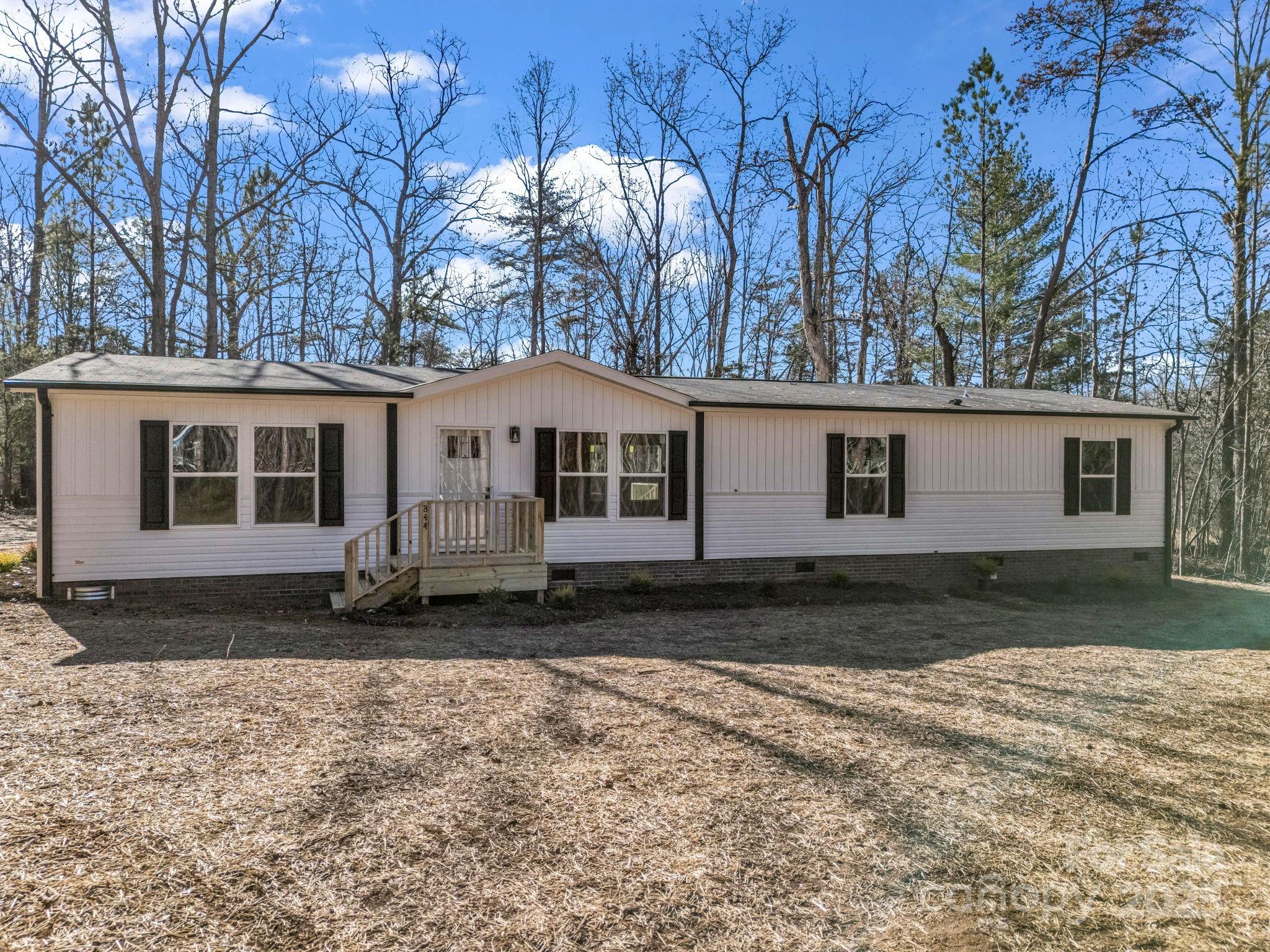 844 Tiney Road Ellenboro, NC 28040 - Photo 4 of 45 a front view of a house with a yard