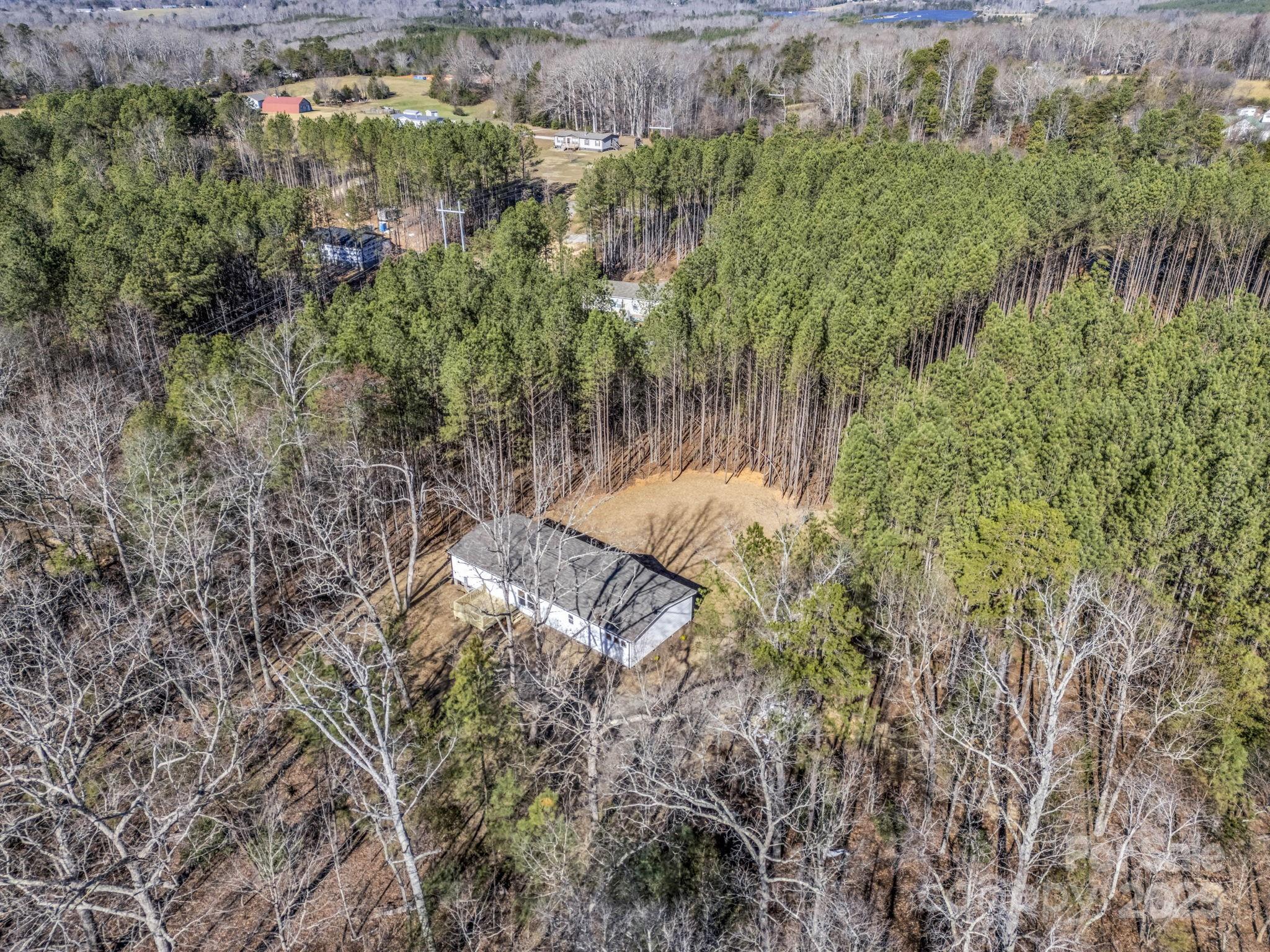 844 Tiney Road Ellenboro, NC 28040 - Photo 44 of 45 a view of a forest with a lake