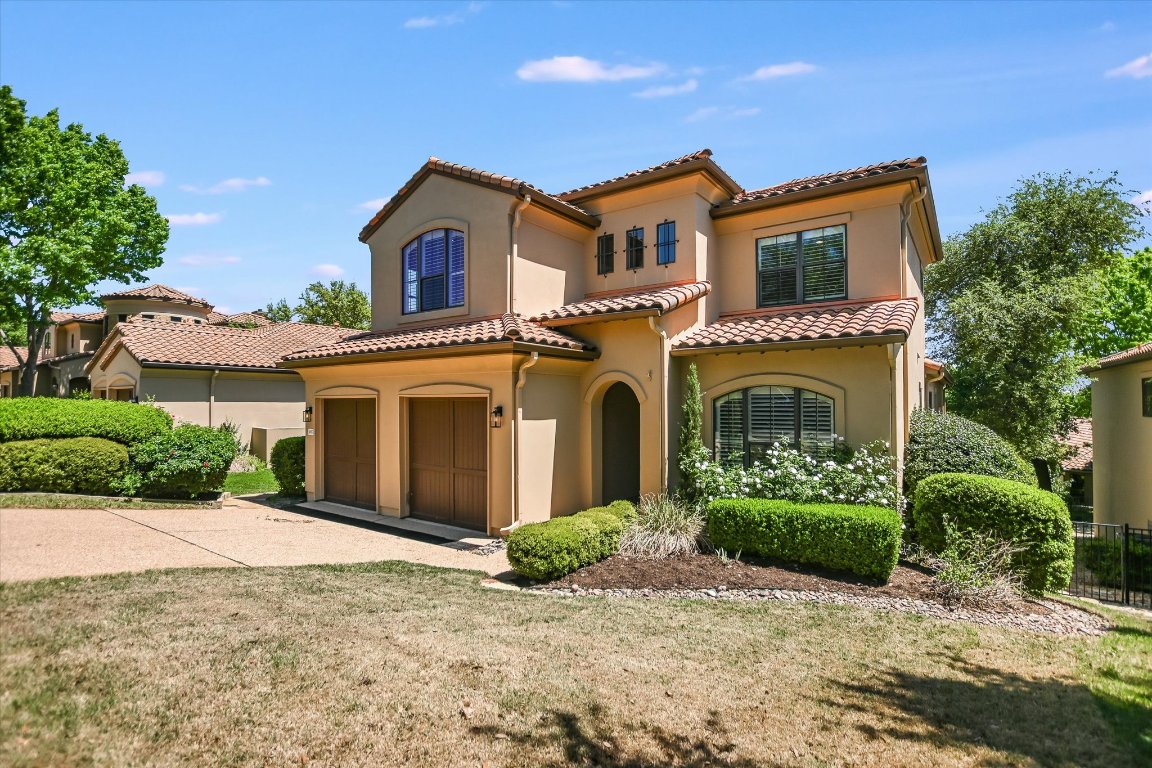 2617 University Club Drive Austin, TX 78732 - Photo 20 of 25 front view of a house with a yard